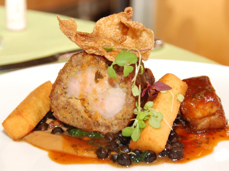 Suckling Pig – Roast loin, cornbread, smoked banana, puffed skin – - Belly, black chickpea, dandelions, mango ketchup