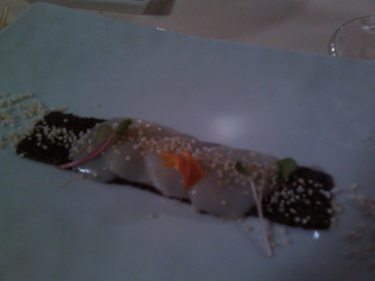 Carpaccio of scallops on amaranth grain and black corn with ginger oil