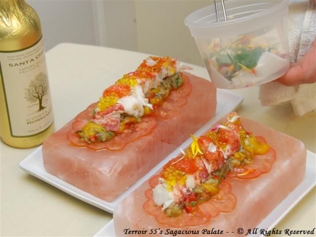 Lobster over heirloom tomatoes and roasted vegetables (onions, eggplant, red, yellow and green peppers) on a Himalayan salt block, topped with extra virgin olive oil and caviar.