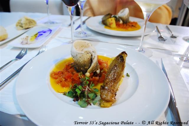 Branzino A L’Aqua Pazza - Branzino filet, steamed in a fresh diced tomato broth, endive and polenta with micro greens