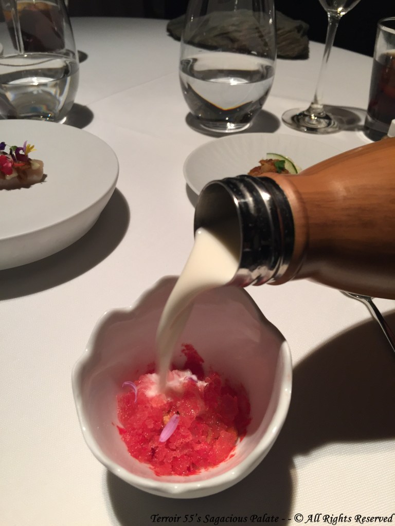 Chilled ajoblanco soup with tomato ice, crisp bread, melon and almonds