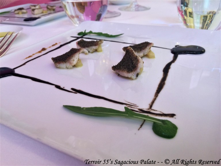 Red mullet gratinated with caper powder from our organic farm, black garlic cream, reduction of red wine and rocket