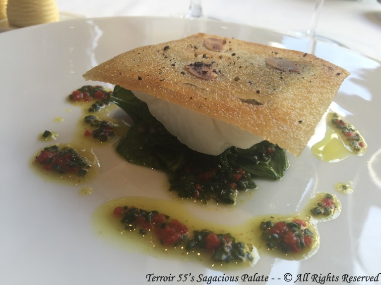 Line Caught Whiting fish from Saint Gilles Croix-de-Vie In a crust of bread with almonds, “New-Zealand” spinach and olive oil flavored with curry and péquillos pepper.