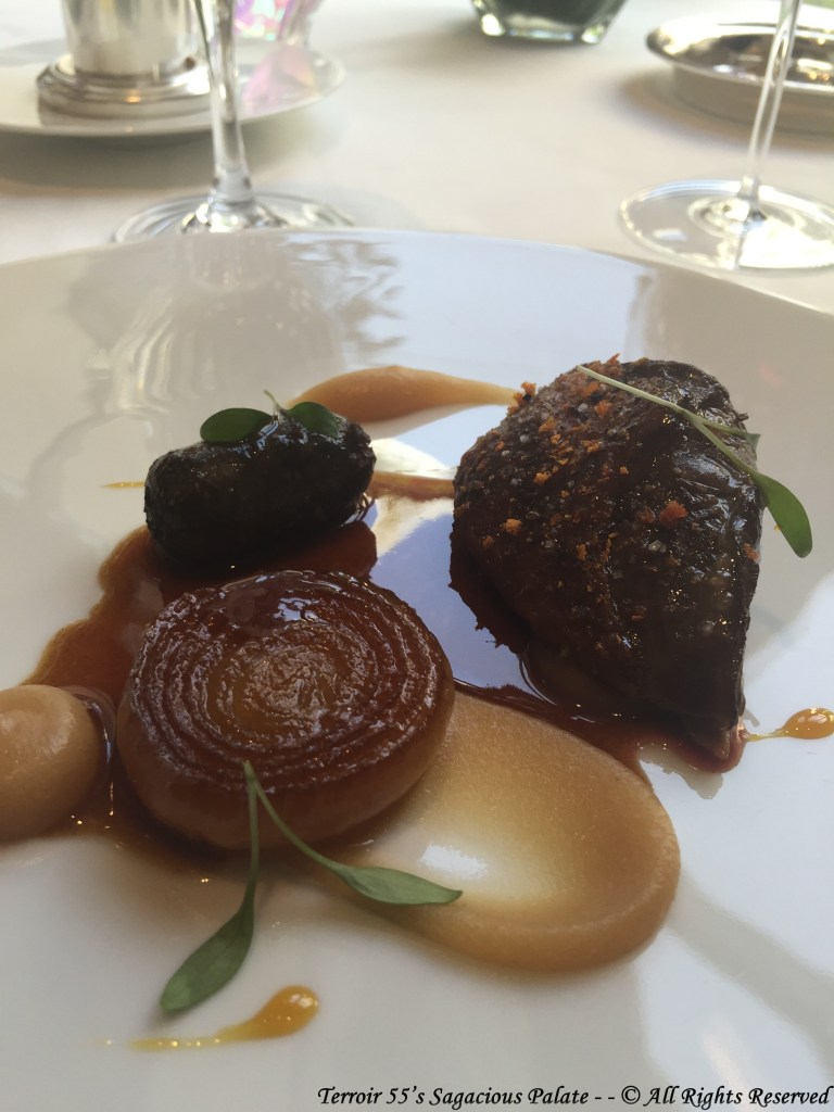 Pigeon from the Bresse area roasted and glazed with orange honey, caramelized onions, black pudding of thighs, baked apple, roasted juice.